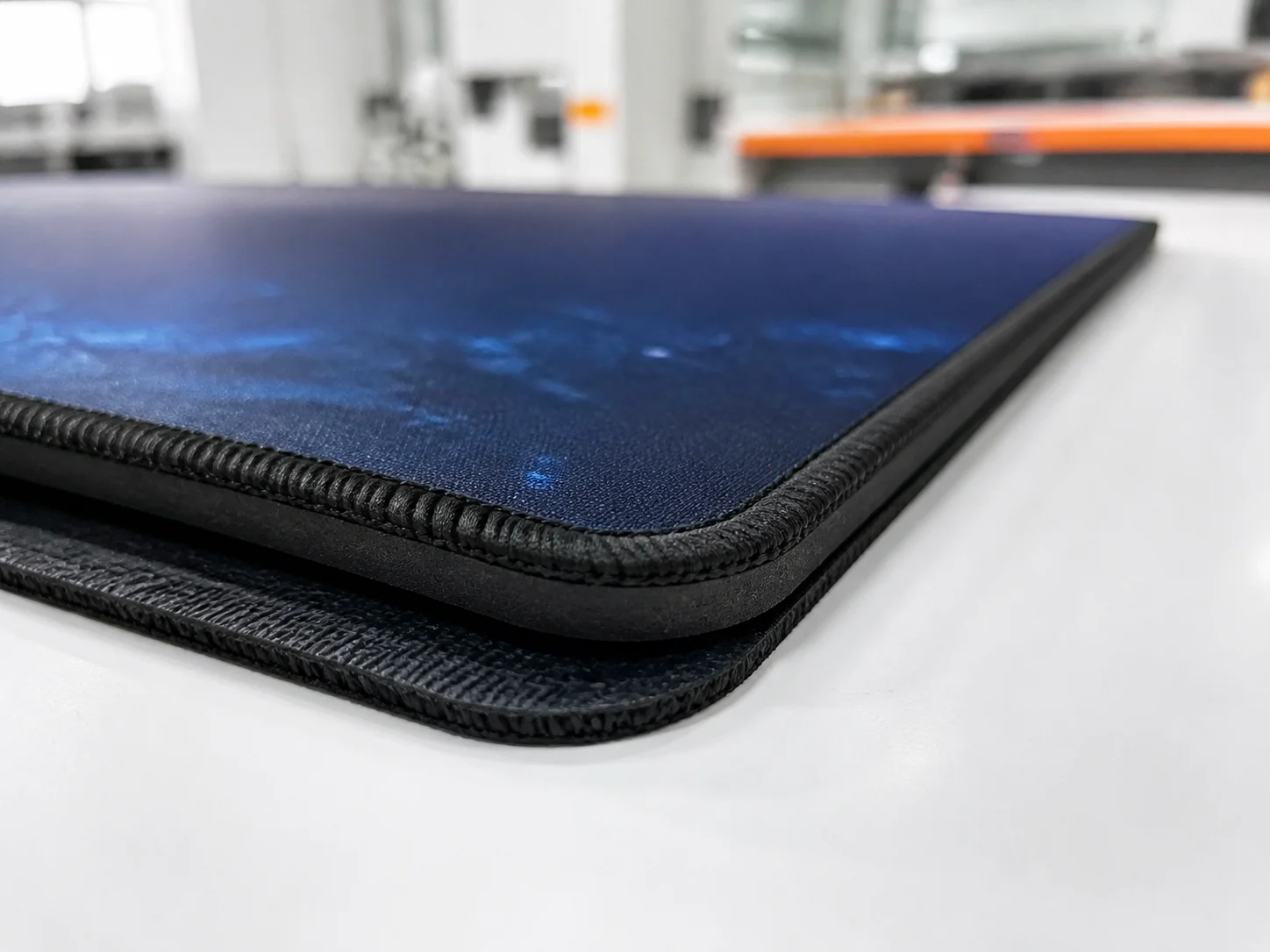 Stitched edge quality detail on custom gaming mouse pad